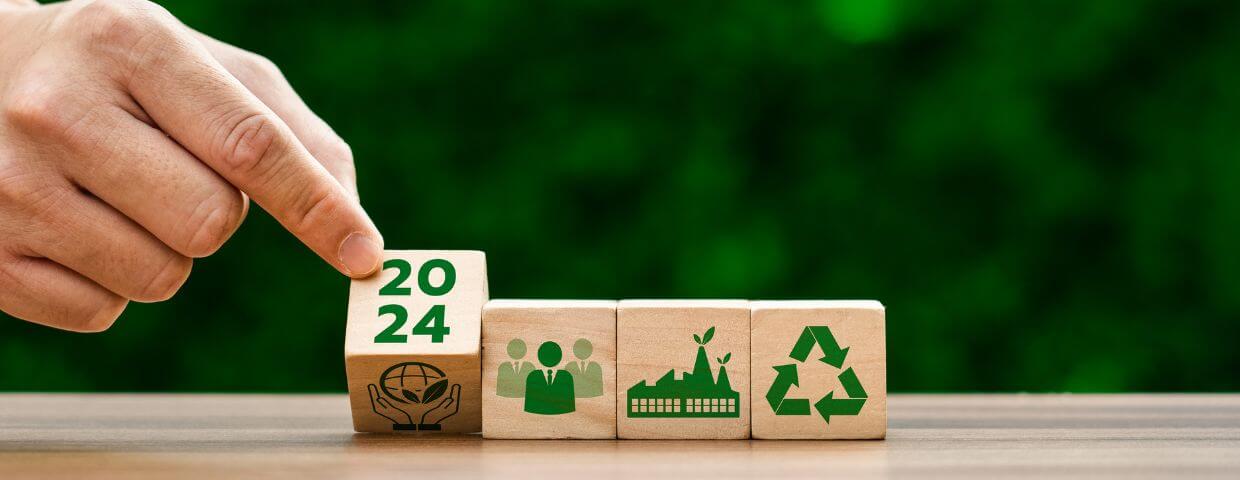 hand turning block to 2024, other blocks with sustainability icons