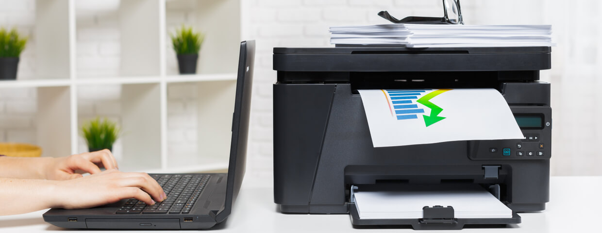 A multifunction printer sitting in an office space.